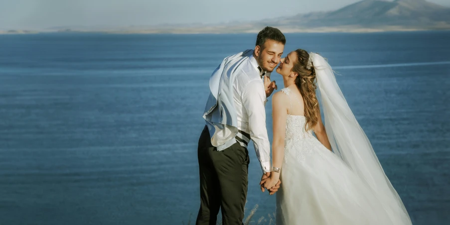 the bride and groom are smiling at each other