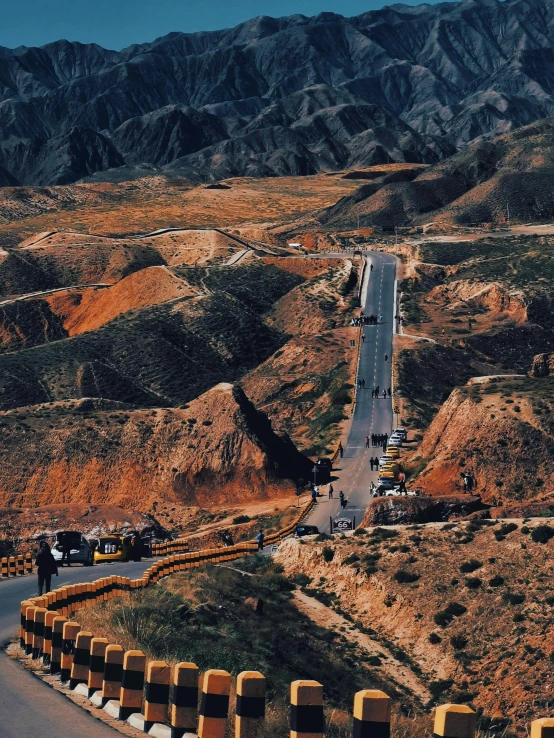 the road is winding while trucks drive along it