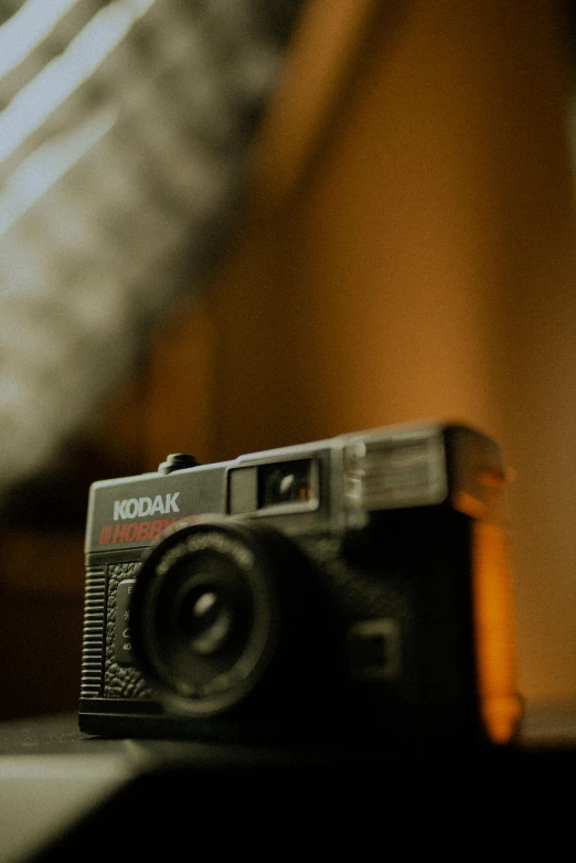 an old camera is sitting on a table