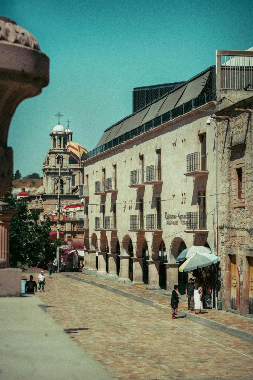 an old city street in europe surrounded by old brick buildings