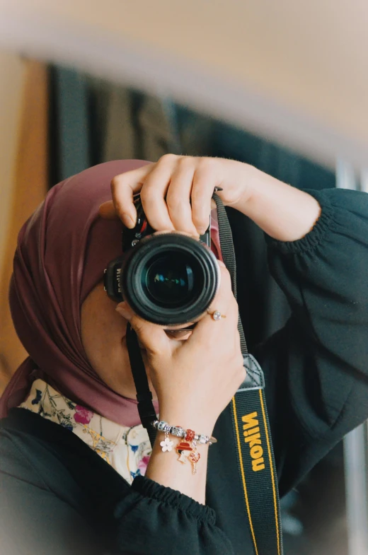 a person taking a po in a mirror with their camera