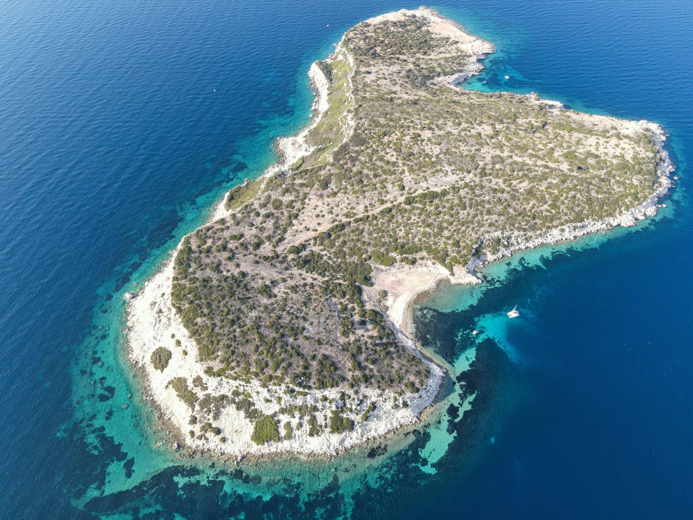 an aerial po of a small tropical island