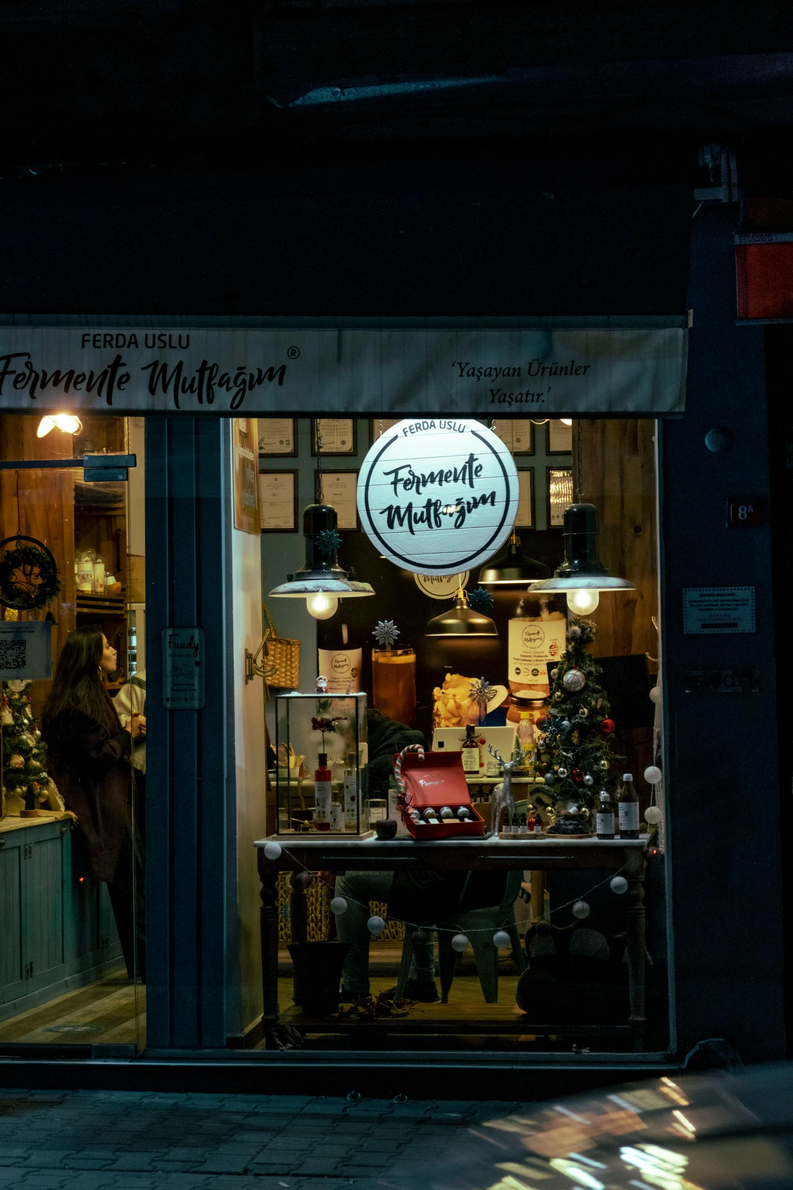 a small store window sitting on the side of a street