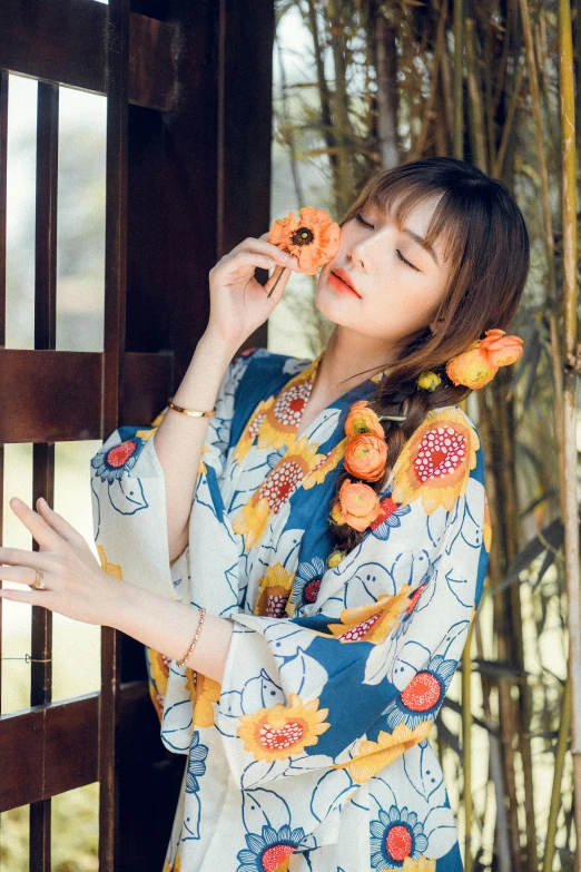 a woman in an oriental kimono eating food