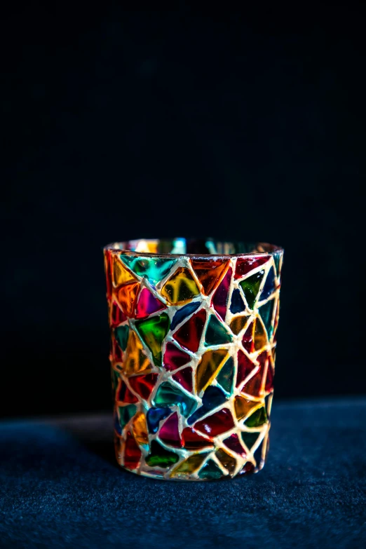 there is a glass that has multicolored shapes on it