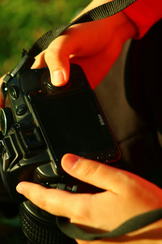 someone holding a camera up to their left and showing the front view