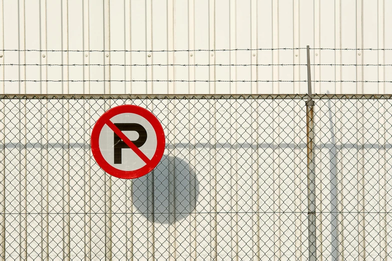 the gate is behind a large wire fence