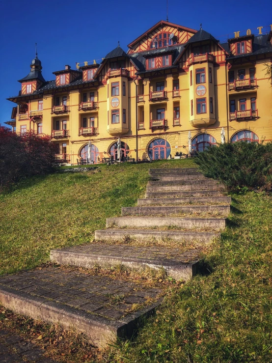 an old mansion with steps leading up to it