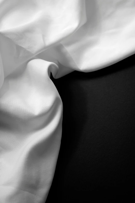a white curtain with a dark background