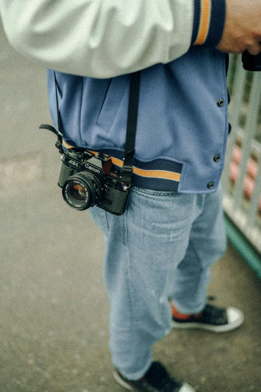 a man with a camera and an ice pack