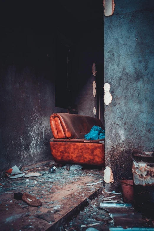 a chair in an old rundown building with soing blue