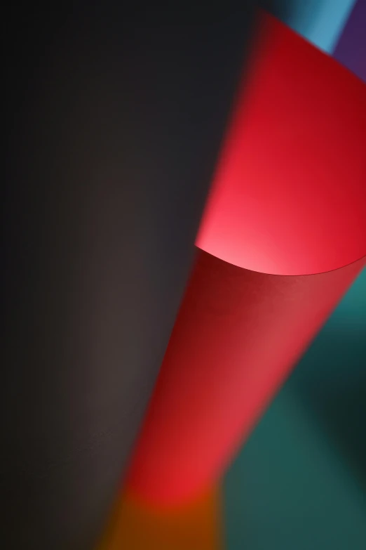 a red cylindrical object with long, thin rays