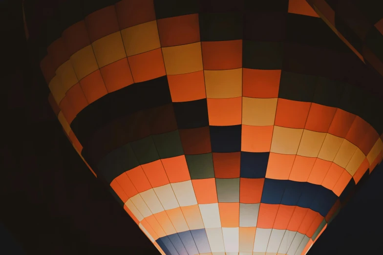 the inside of a colorful balloon that appears to be floating