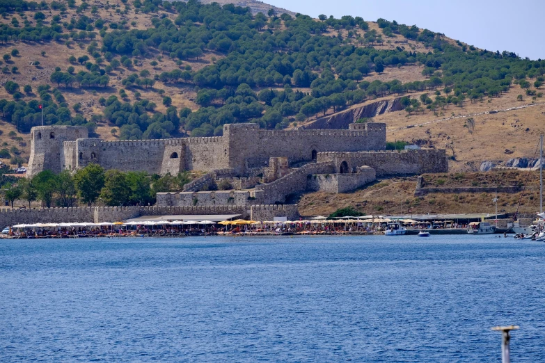 several boats and vehicles are docked at an outdoor marina