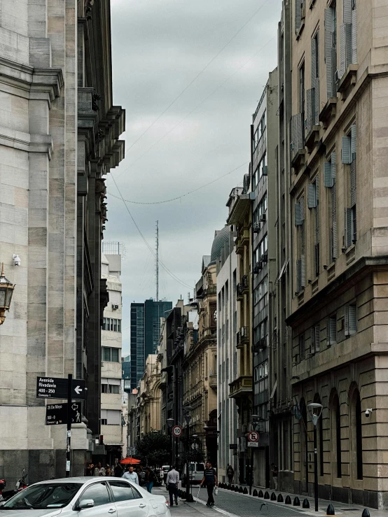 a street in an urban area with tall buildings