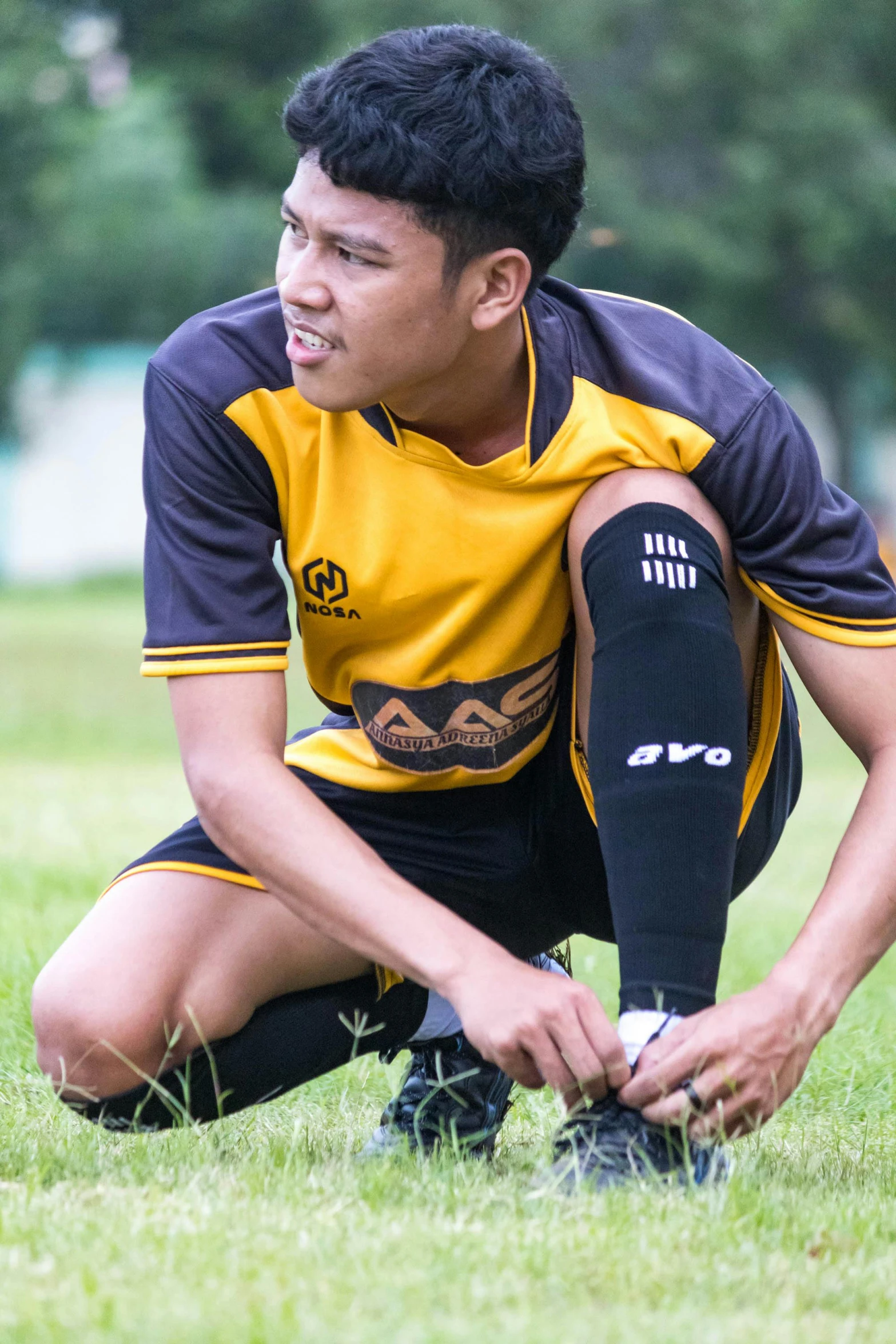 a person kneeling down in a field