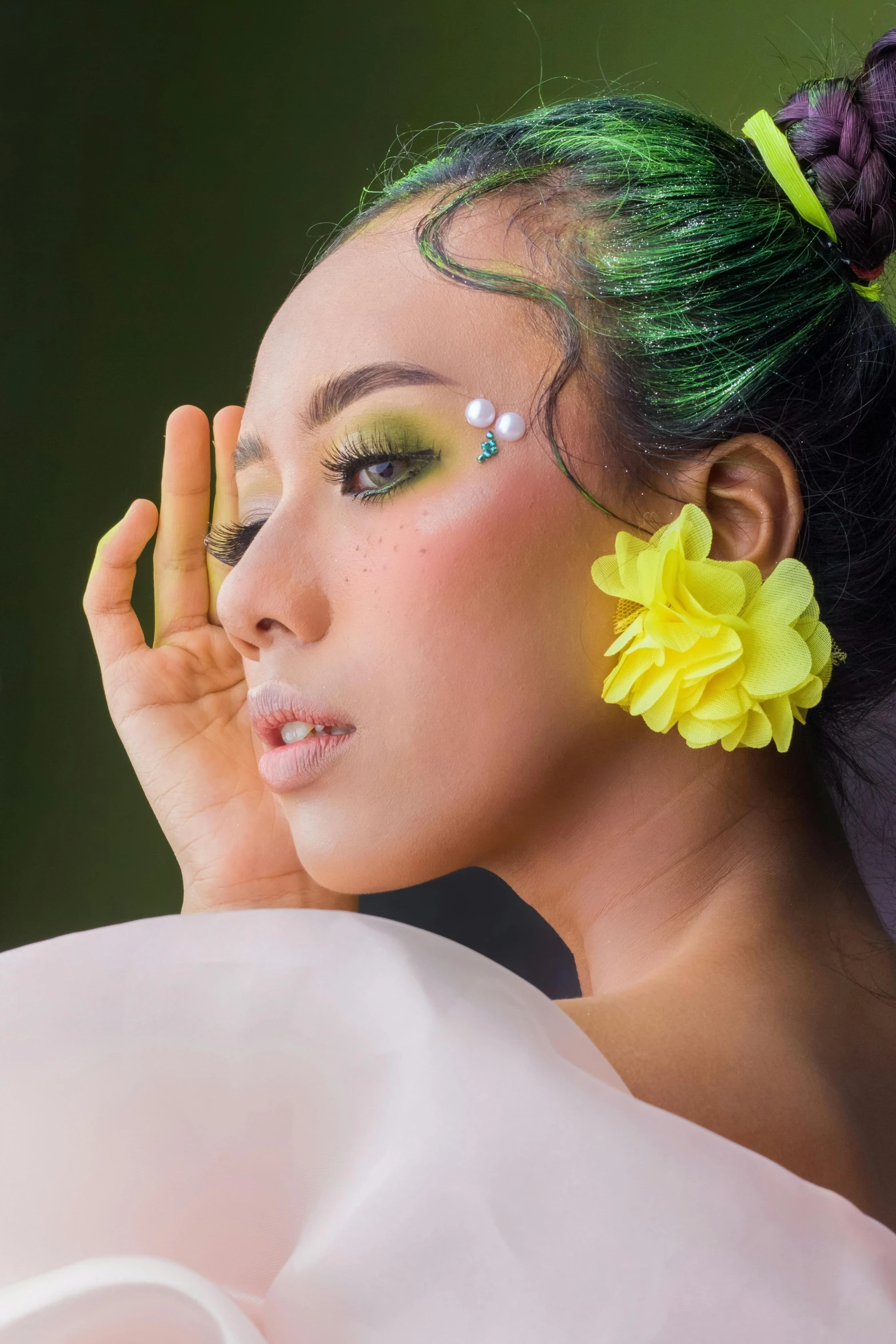 a woman with long hair and neon flowers