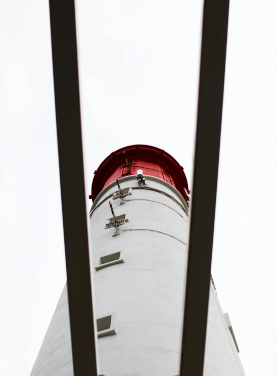 the white and red tower has a red top