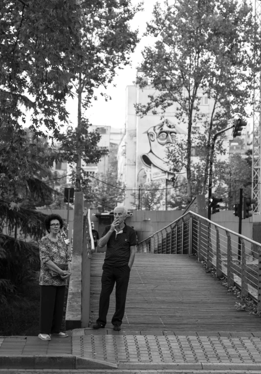 two elderly men are on the boardwalk together