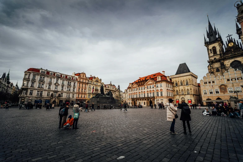 the square in prague is busy with people