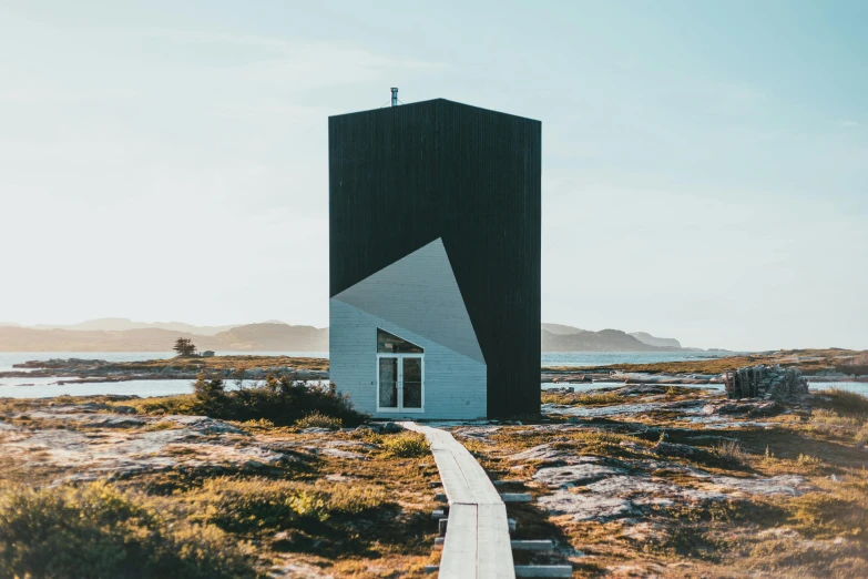 an unusual building has the shape of a large triangular building with a steep sloping walkway