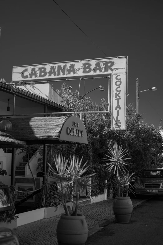 a black and white po shows a california bar in an urban setting