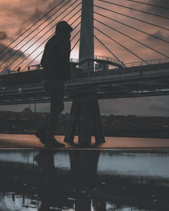 a person walking with his shoes on by the water