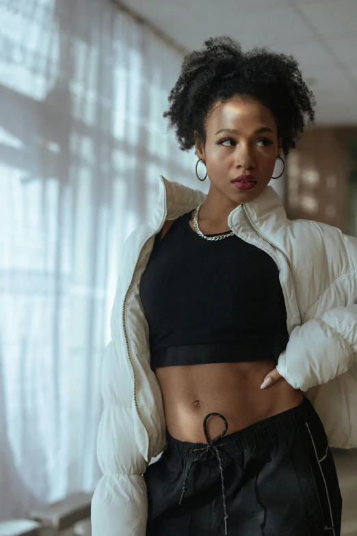 a woman in a white jacket and black skirt