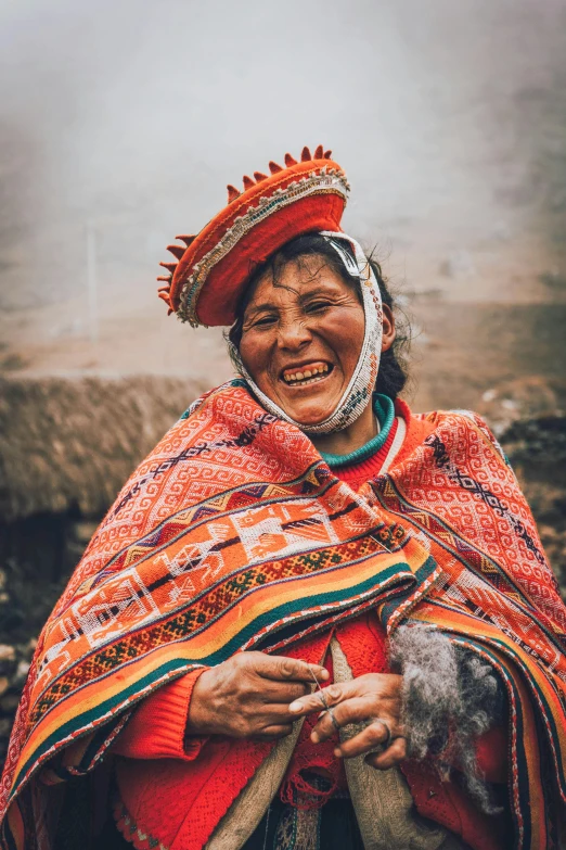 an older woman with a red and orange scarf