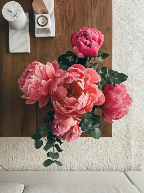 two large pink flowers with one smaller pink flower