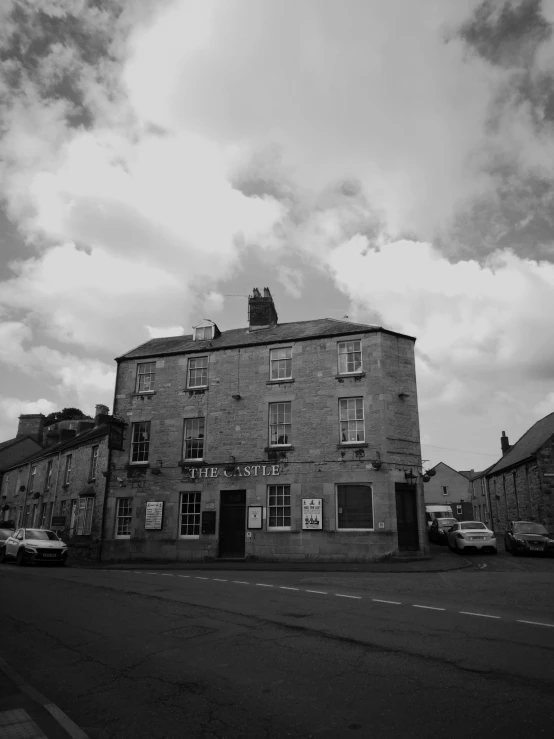 an old brick building sitting on the corner