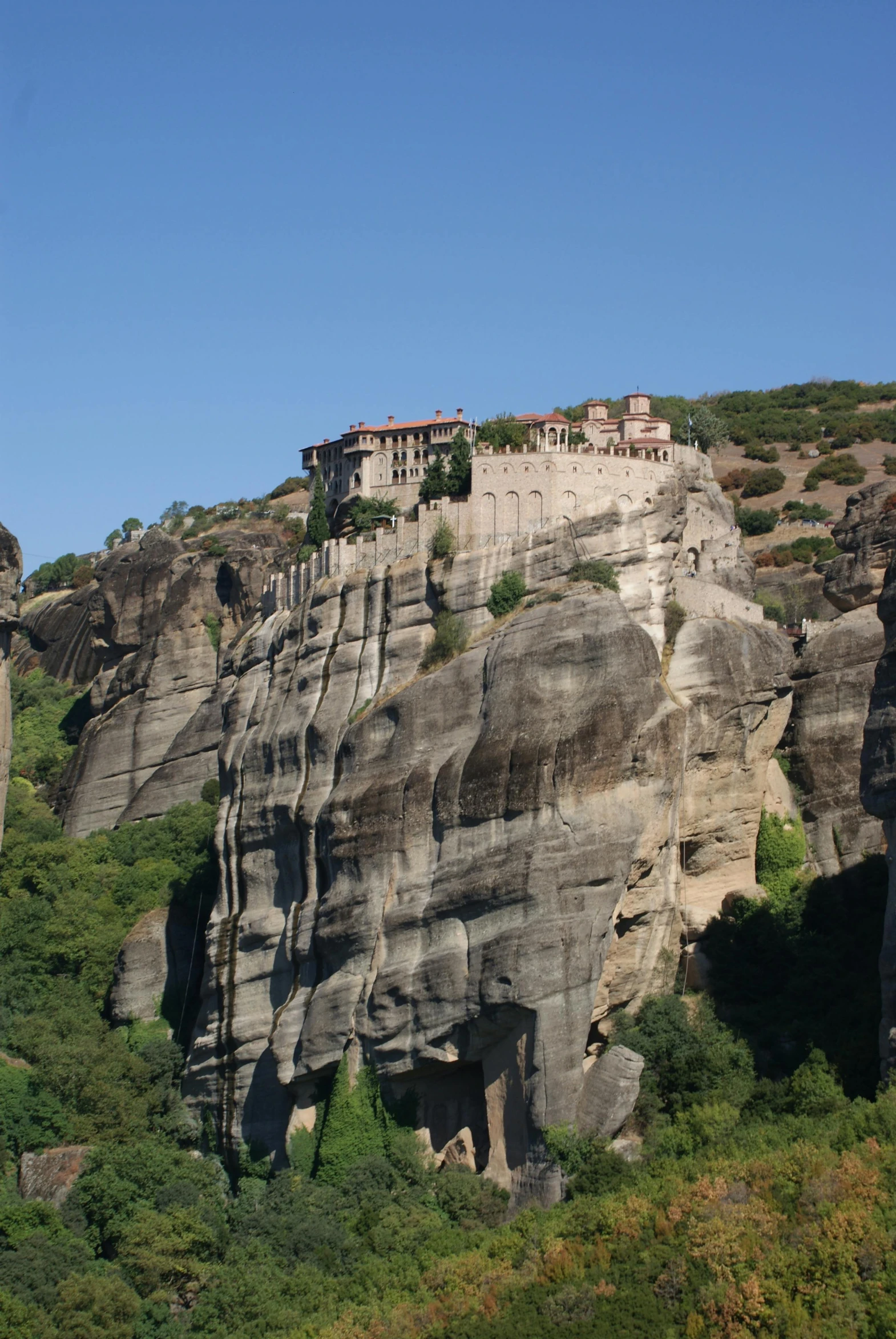 a castle perched on the side of a cliff