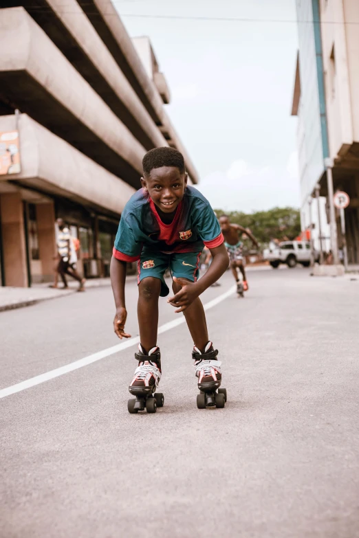 a  on roller skates in the middle of the road