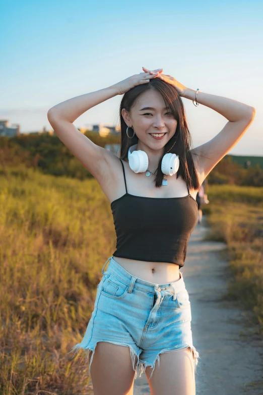 a young woman in shorts posing for a picture