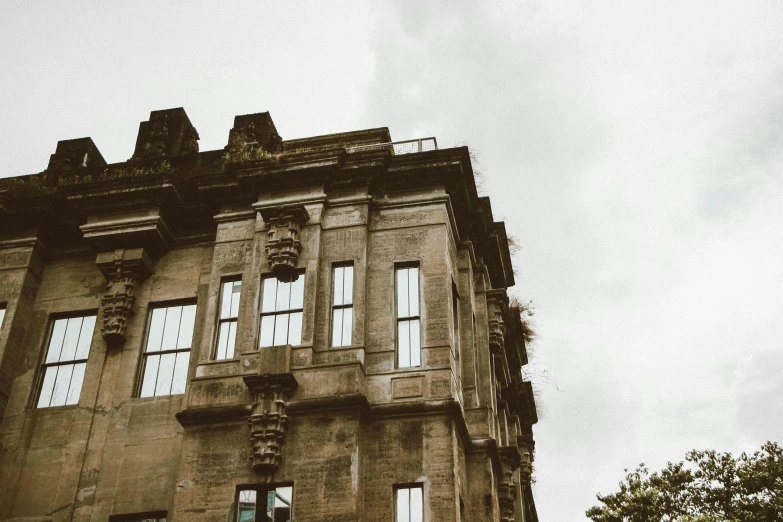 an old building with windows and a bird nest in it