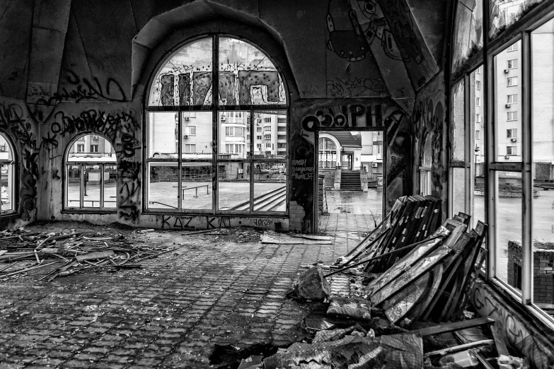 graffiti covered windows and doors at an old rundown building