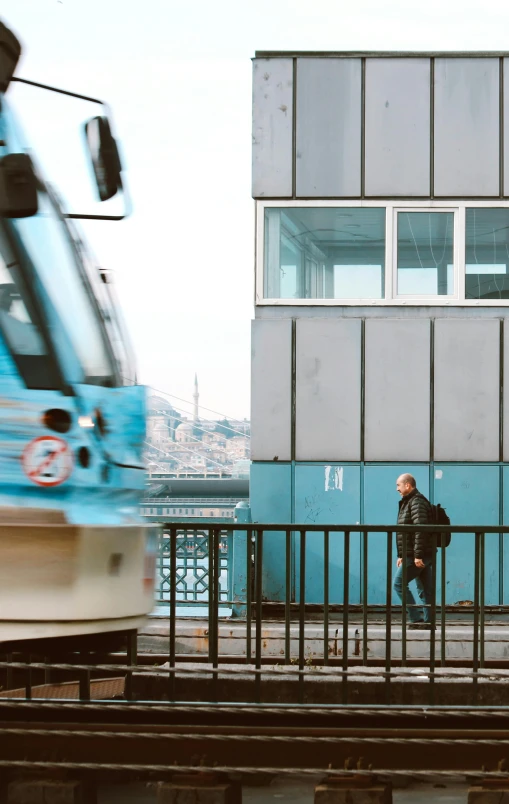 a train and people next to the rails