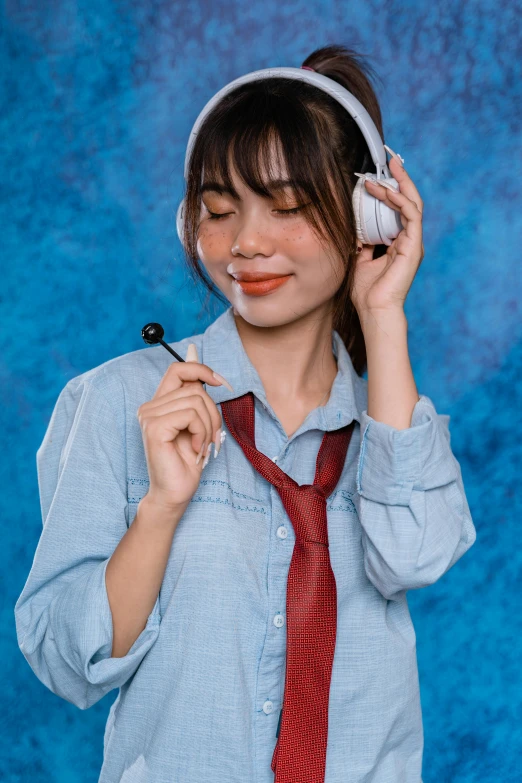 a woman holding an electric device to her head