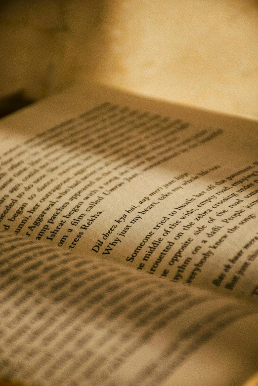 an old book sitting on top of a wooden table