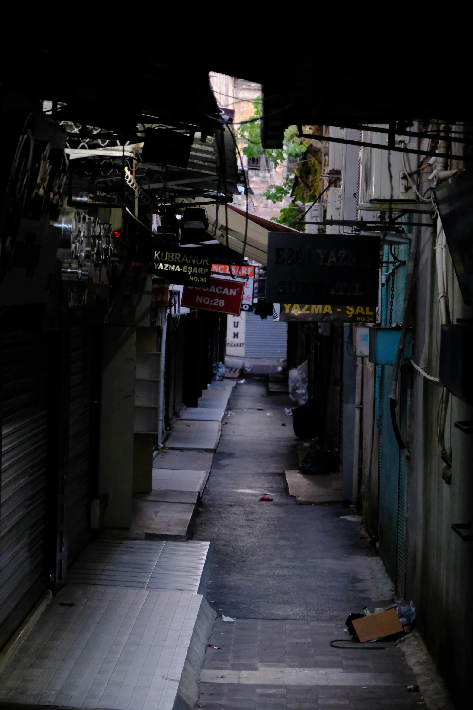 an alley way that is very narrow and empty