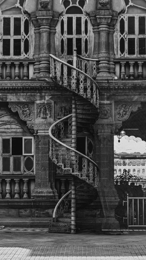 an ornate brick building with spiral stairs