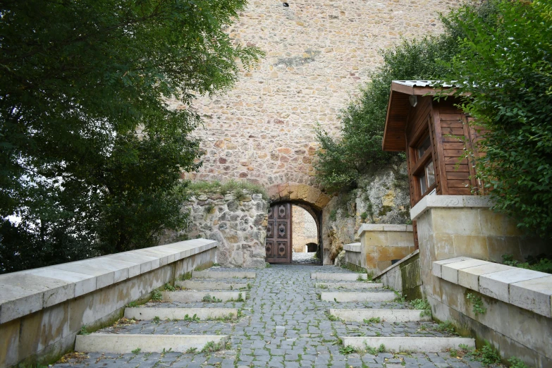 there are steps leading to a door in an old building