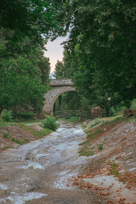 a road with a water running under it