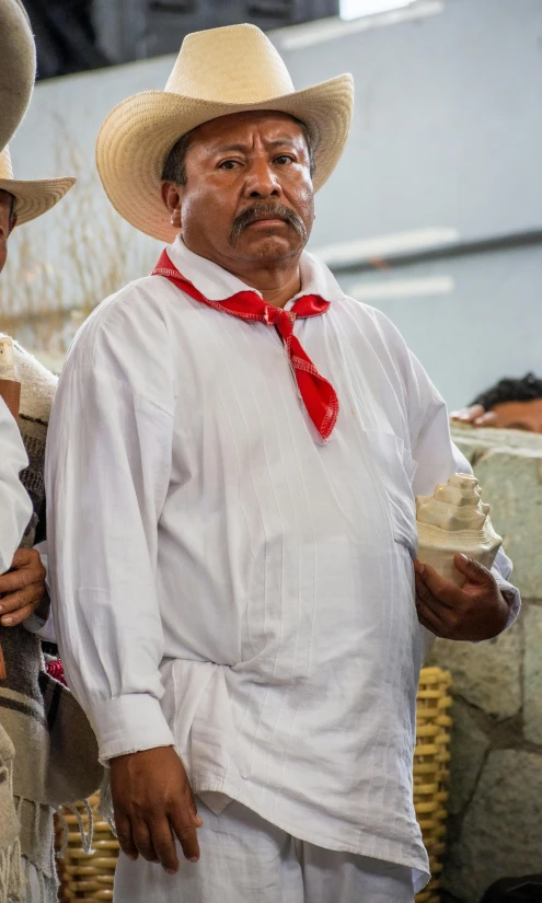 two men wearing cowboy hats and ties