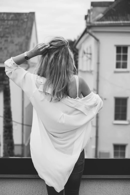 black and white pograph of woman with back turned