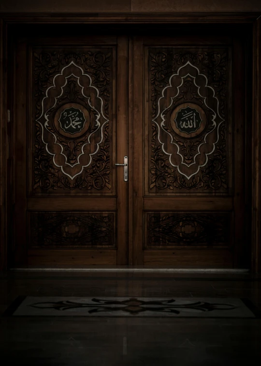 the two doors are set side by side with intricate designs