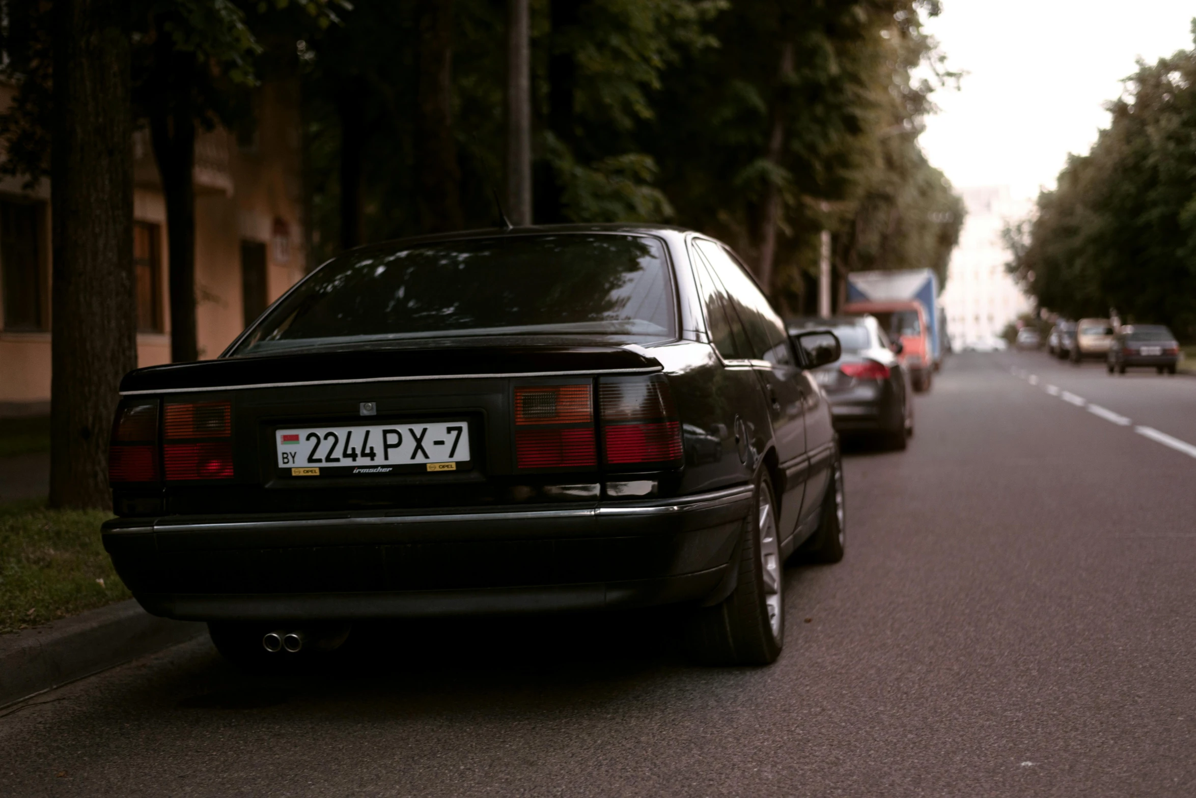 a group of cars parked along the street