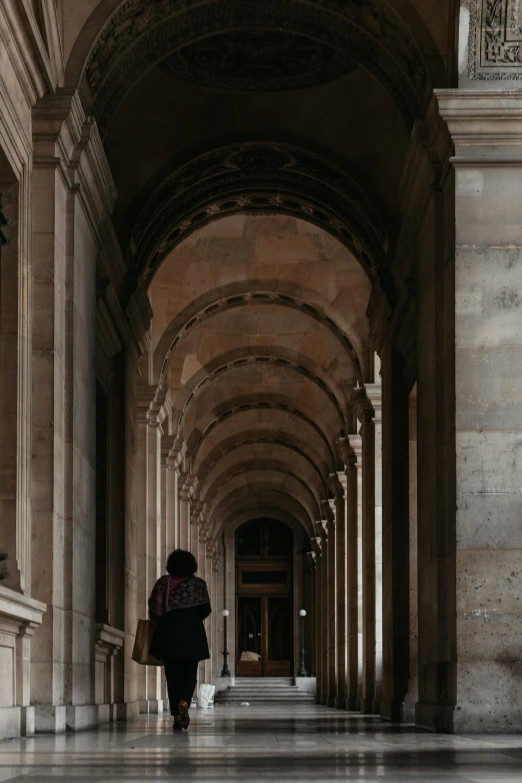 an old building with a person walking through it