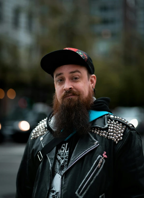 a man with a full beard wearing a hat