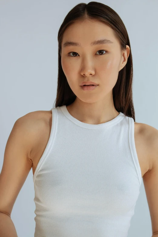 a asian woman in white top posing for a picture